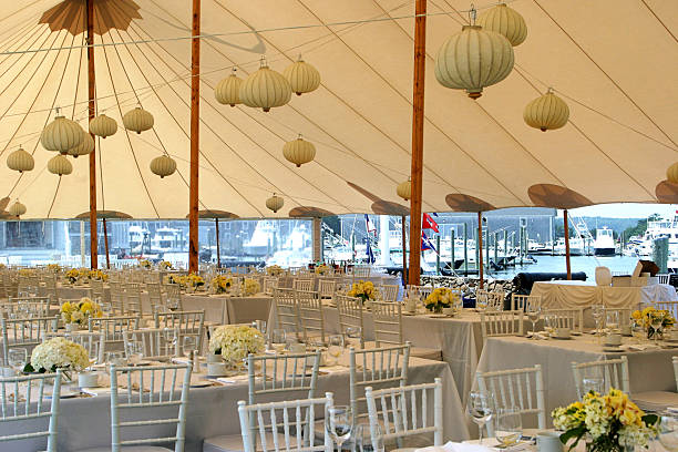 Inside of a tented wedding reception site on cape cod.